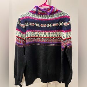 Chaps size XL . Black sweater with purple red green accents.